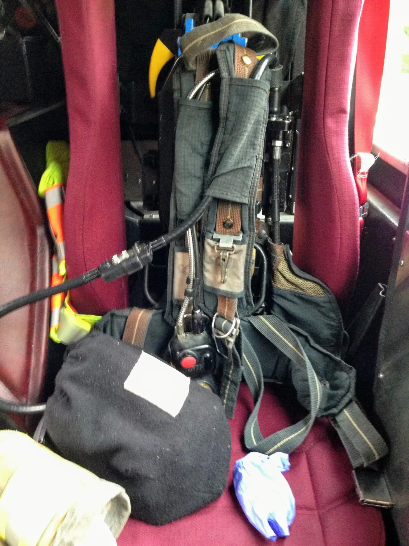 A seat on the fire engine with an air pack and gear ready to go