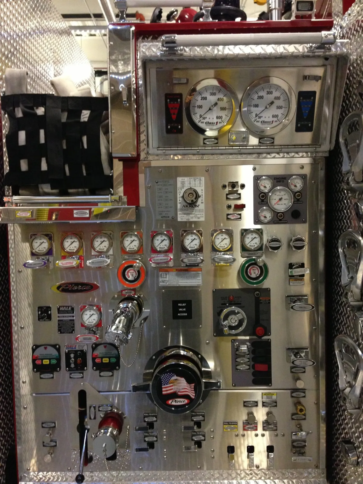 The pump panel of a fire engine, full of gauges and valves