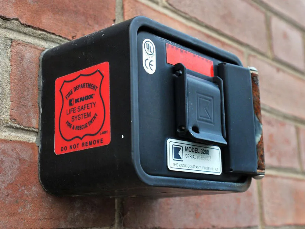 A Knox box, a small locked safe mounted on a brick wall