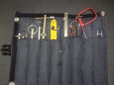 Elevator keys laid out on a cloth tool roll